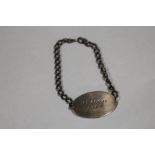 A WORLD WAR II SILVER ID BRACELET