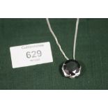 A MODERN STERLING SILVER AND BLACK DIAMOND STYLE PENDANT ON CHAIN