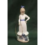 A NAO FIGURE OF A GIRL WITH A HOOLA HOOP