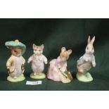 FOUR GOLD STAMPED BESWICK BEATRIX POTTER FIGURES COMPRISING OF PETER RABBIT, HUNCA MUNCA SWEEPING,