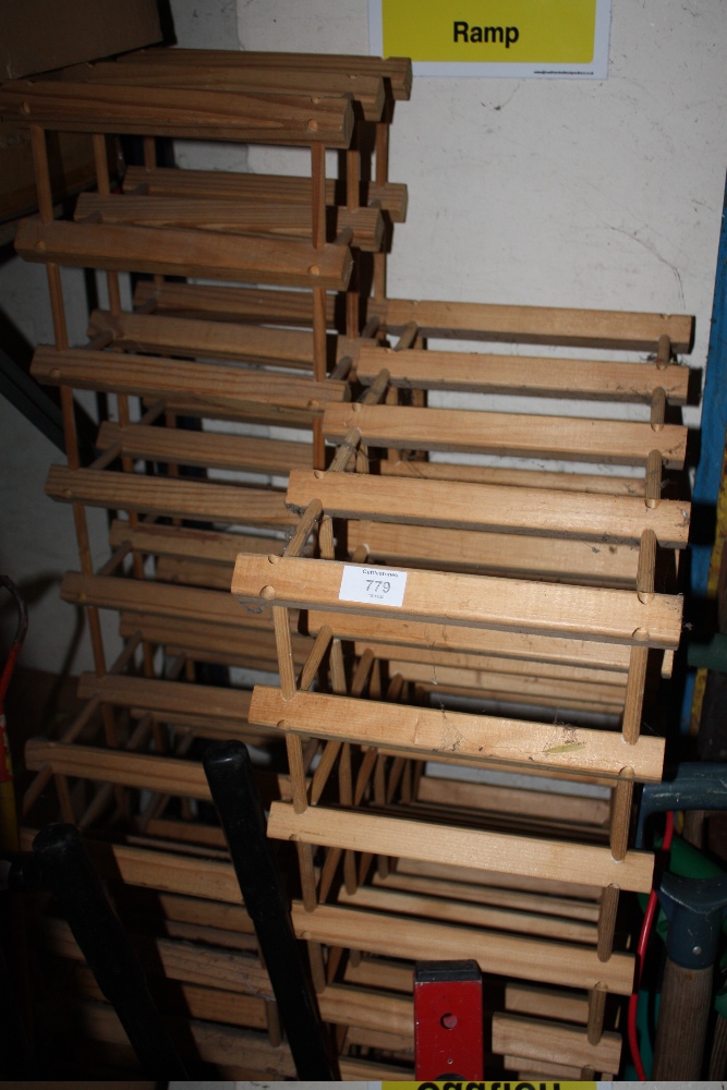 A QUANTITY OF WOODEN WINE RACKS