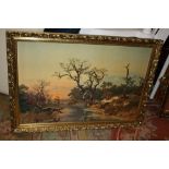 A LARGE GILT FRAMED LANDSCAPE PRINT