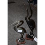 A PAIR OF BUFFALO HORN STORK FIGURES