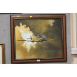 A FRAMED OIL ON BOARD OF A SPITFIRE SIGNED T CAINE LOWER RIGHT