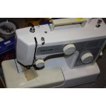 A RICCAR 650 SEWING MACHINE AND ACCESSORIES