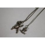 TWO ARTICULATED SILVER TEDDY BEAR PENDANTS ON CHAINS