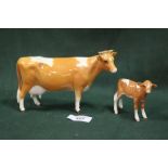 A BESWICK GUERNSEY COW AND CALF - BOTH A/F