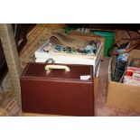 A CASED SINGER SEWING MACHINE TOGETHER WITH TWO BOXES OF ACCESSORIES ETC.