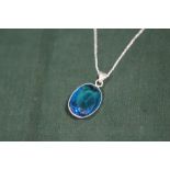 A STERLING SILVER AND BLUE TOPAZ PENDANT ON CHAIN