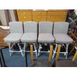 A SET OF FOUR MODERN UPHOLSTERED SWIVEL BAR STOOLS