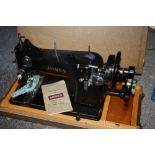 A CASED VINTAGE JONES SEWING MACHINE