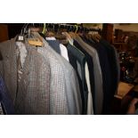 A RAIL OF VINTAGE GENTS CLOTHING, various styles and periods including two piece suits, 3pc