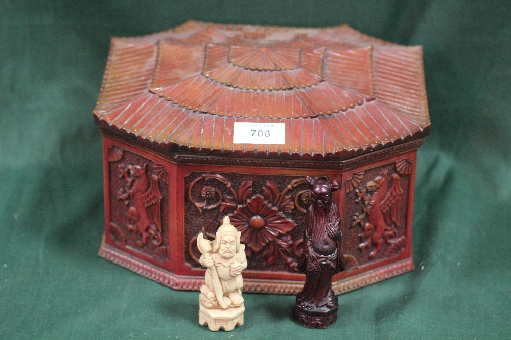 AN ORIENTAL STYLE RESIN CHESS SET CONTAINED IN A WOODEN PAGODA SHAPED BOX