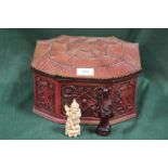AN ORIENTAL STYLE RESIN CHESS SET CONTAINED IN A WOODEN PAGODA SHAPED BOX