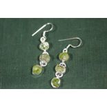 A PAIR OF STERLING SILVER AND PERIDOT EARRINGS