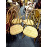 A SET OF FOUR ERCOL HOOP BACK DINING CHAIRS INCLUDING TWO ARMCHAIRS (4)