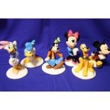 A SET OF SIX BOXED ROYAL DOULTON GOLD STAMPED MICKEY MOUSE COLLECTION FIGURES