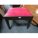 A MODERN BLACK AND PINK UPHOLSTERED STOOL