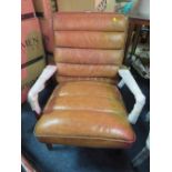 A MODERN TAN LEATHER ARMCHAIR S/D