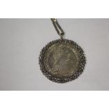 A COIN PENDANT ON SILVER CHAIN