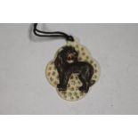 A CARVED AND PIERCED VICTORIAN TYPE IVORY PENDANT DECORATED WITH A LION, H 5.5 cm A/FCondition