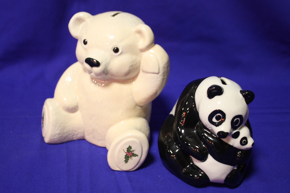 A WADE MONEY BANK IN THE FORM OF A PANDA WITH CUB TOGETHER WITH A TEDDY BEAR SHAPED EXAMPLE