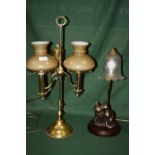 AN ADJUSTABLE BRASS TWIN BULB TABLE LAMP TOGETHER WITH A FRITHS SCULPTURE 'YUMYUM AND FRIEND' LAMP