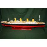 A HAND BUILT WOODEN MODEL OF THE TITANIC