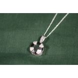 A STERLING SILVER AND BLACK DIAMOND STYLE PENDANT ON CHAIN