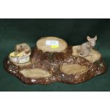 A BESWICK TREE STUMPS SHAPED DISPLAY STAND, TOGETHER WITH TWO BESWICK MOUSE FIGURES (3)