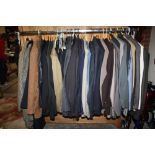 A RAIL OF VINTAGE GENTS CLOTHING, various styles and periods to include tweed style coat and