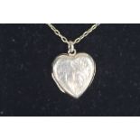 A 9CT BK & FT HEART SHAPED LOCKET