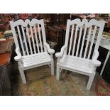 A LARGE PAIR OF PAINTED WOODEN ARMCHAIRS