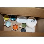 A SET OF SIX SUSIE COOPER CUPS AND SAUCERS WITH HARLEQUIN COLOURED INTERIORS