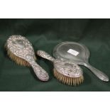 TWO HALLMARKED SILVER BRUSHES TOGETHER WITH A HALLMARKED SILVER HAND MIRROR (3)