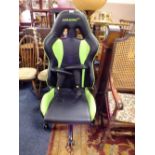 AN AK RACING GREEN AND BLACK GAMING STYLE SWIVEL ARMCHAIR