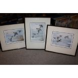 THREE FRAMED AND GLAZED SIGNED JOHN CYRILL HARRISON PRINTS WITH BLIND STAMPS DEPICTING DUCKS FLIGHT