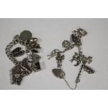 TWO VINTAGE SILVER CHARM BRACELETS