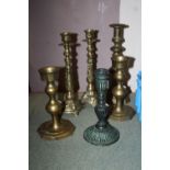 A COLLECTION OF SIX ASSORTED METAL CANDLESTICKS