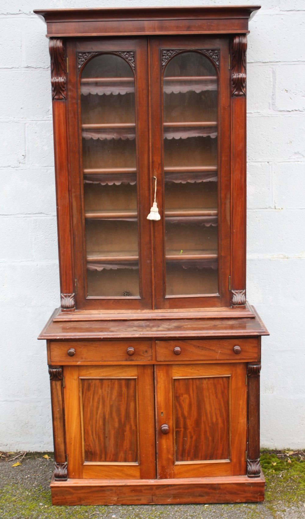 A 19TH CENTURY MAHOGANY GLAZED FLOORSTANDING BOOKCASE OF SLIM PROPORTIONS, the glazed, twin door