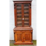 A 19TH CENTURY MAHOGANY GLAZED FLOORSTANDING BOOKCASE OF SLIM PROPORTIONS, the glazed, twin door