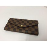 LOUIS VUITTON - a brown / beige purse