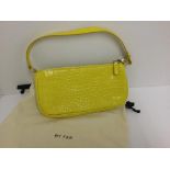 BY FAR - a yellow handbag