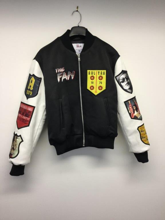 THE FAN - a ladies black jacket with white sleeves, size small