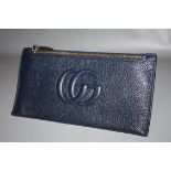 GUCCI - a ladies blue zippered top leather wallet