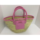 JACQUEMUS - a pink wicker bag