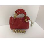 SCOTRIA - a red handbag