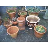 A COLLECTION OF NINE PLANTERS TO INCLUDE A CHIMNEY POT