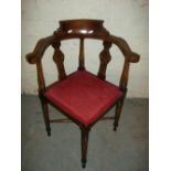 AN ANTIQUE OAK CORNER CHAIR