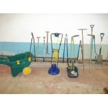 A QUANTITY OF GARDEN TOOLS INCLUDING A MOWER AND A WHEELBARROW